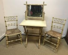 A painted faux bamboo framed dressing table with raised mirror back over a single drawer on an X