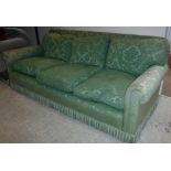 A green foliate upholstered three seat sofa with scroll arms 220 cm wide x 92 cm deep