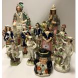 Eleven various 19th Century Staffordshire figures including Scotsman in formal kilt dress 38 cm