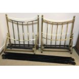 A pair of tubular brass framed single bedsteads with upholstered bases in the Victorian style,