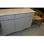 A painted pine dresser, the plain top above three drawers and three cupboard doors on bracket feet,