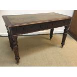 A Victorian walnut writing table,