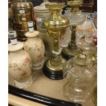 Two Victorian brass oil lamps, one with clear glass and one with brass reservoirs 44.