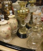 Two Victorian brass oil lamps, one with clear glass and one with brass reservoirs 44.