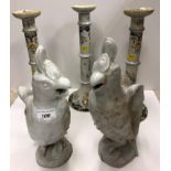 A set of three circa 1900 French faience polychrome decorated altar type candlesticks with ringed