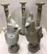 A set of three circa 1900 French faience polychrome decorated altar type candlesticks with ringed