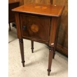 An Edwardian mahogany two door pot cupboard with drop-leaf top on square tapered splayed supports,