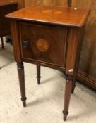 An Edwardian mahogany two door pot cupboard with drop-leaf top on square tapered splayed supports,