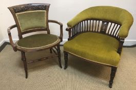 An Edwardian mahogany and inlaid salon elbow chair on turned legs united by turned stretchers,