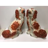 A pair of 19th Century Staffordshire brown and white Spaniel figures, 32.5 cm and 31.