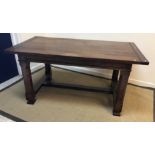 An oak refectory-style dining table in the 19th Century style,