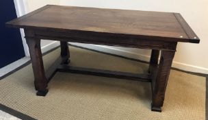 An oak refectory-style dining table in the 19th Century style,