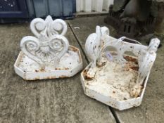 A pair of 19th Century painted cast iron boot scrapes in the Empire taste with integral trays,