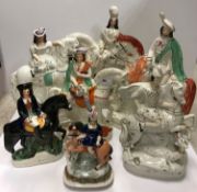 A collection of seven 19th Century Staffordshire figures on horseback including "Scotsman with stag