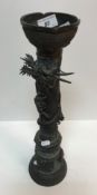 A 19th Century Chinese bronze candle holder,