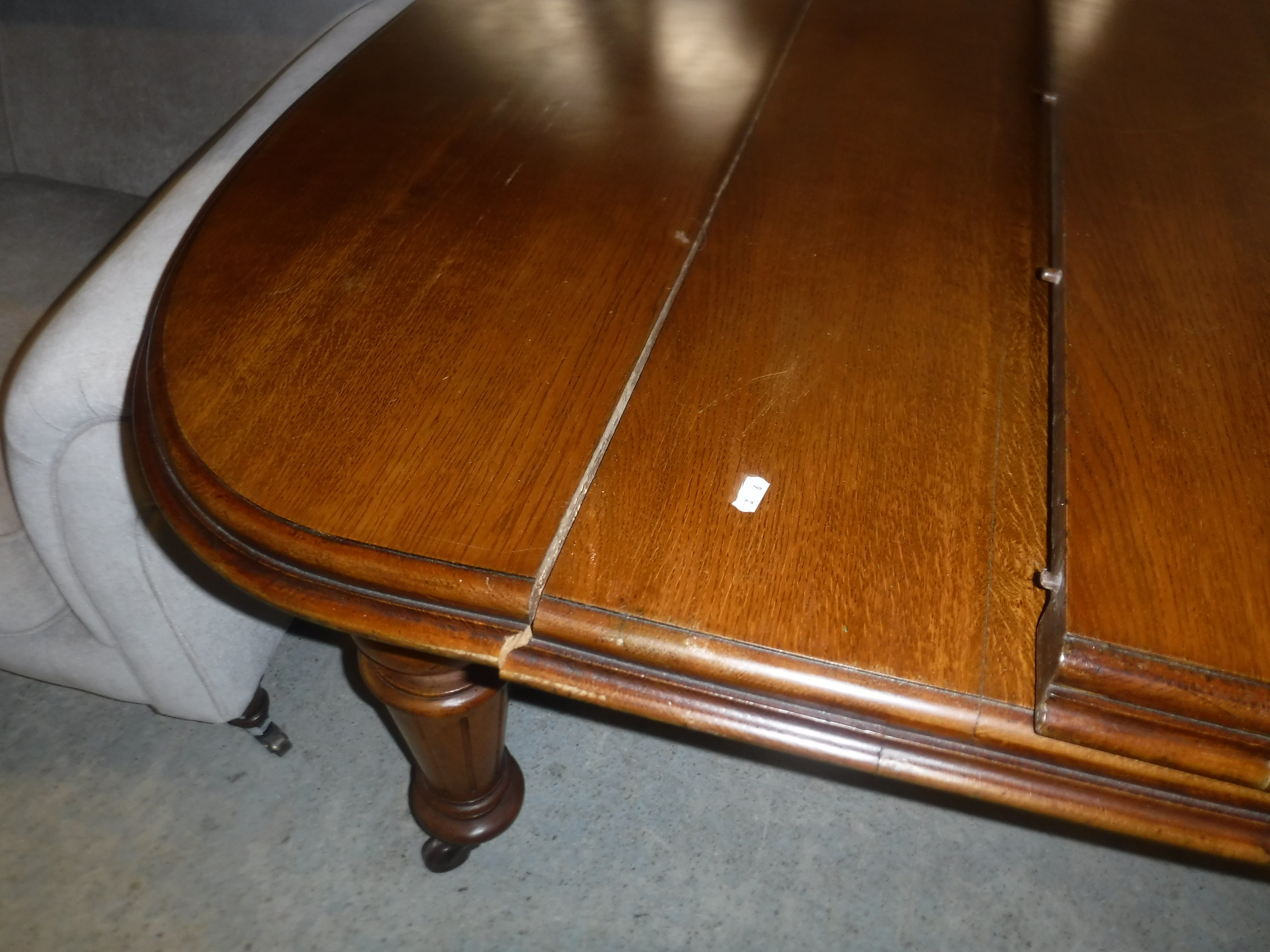 A Victorian oak shallow D end extending dining table with three extra leaves and moulded edge, - Image 6 of 20
