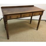 A circa 1800 oak tea table, the oval top on a birdcage to turned tapering pedestal and tripod base,
