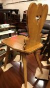 A pair of 20th Century Tyrolean oak panel seated hall chairs on splayed chamfered supports, 36.