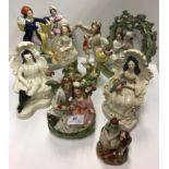A collection of seven 19th Century Staffordshire figures of couples including "Fisherman and fish