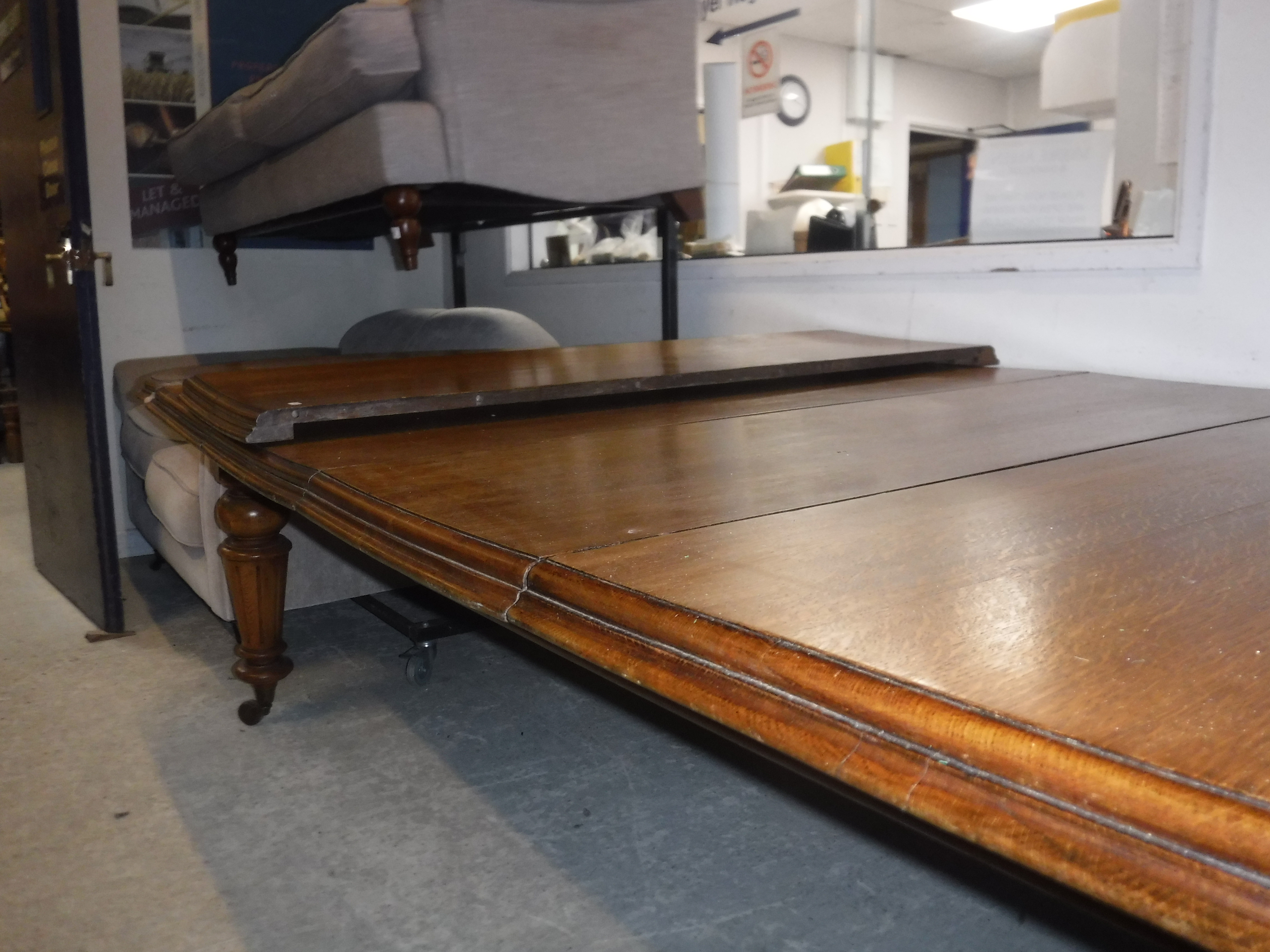 A Victorian oak shallow D end extending dining table with three extra leaves and moulded edge, - Image 19 of 20