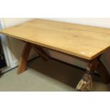 A light oak refectory style dining table in the Arts & Crafts taste,