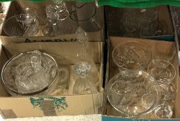 Four boxes of various glassware to include four various decanters,