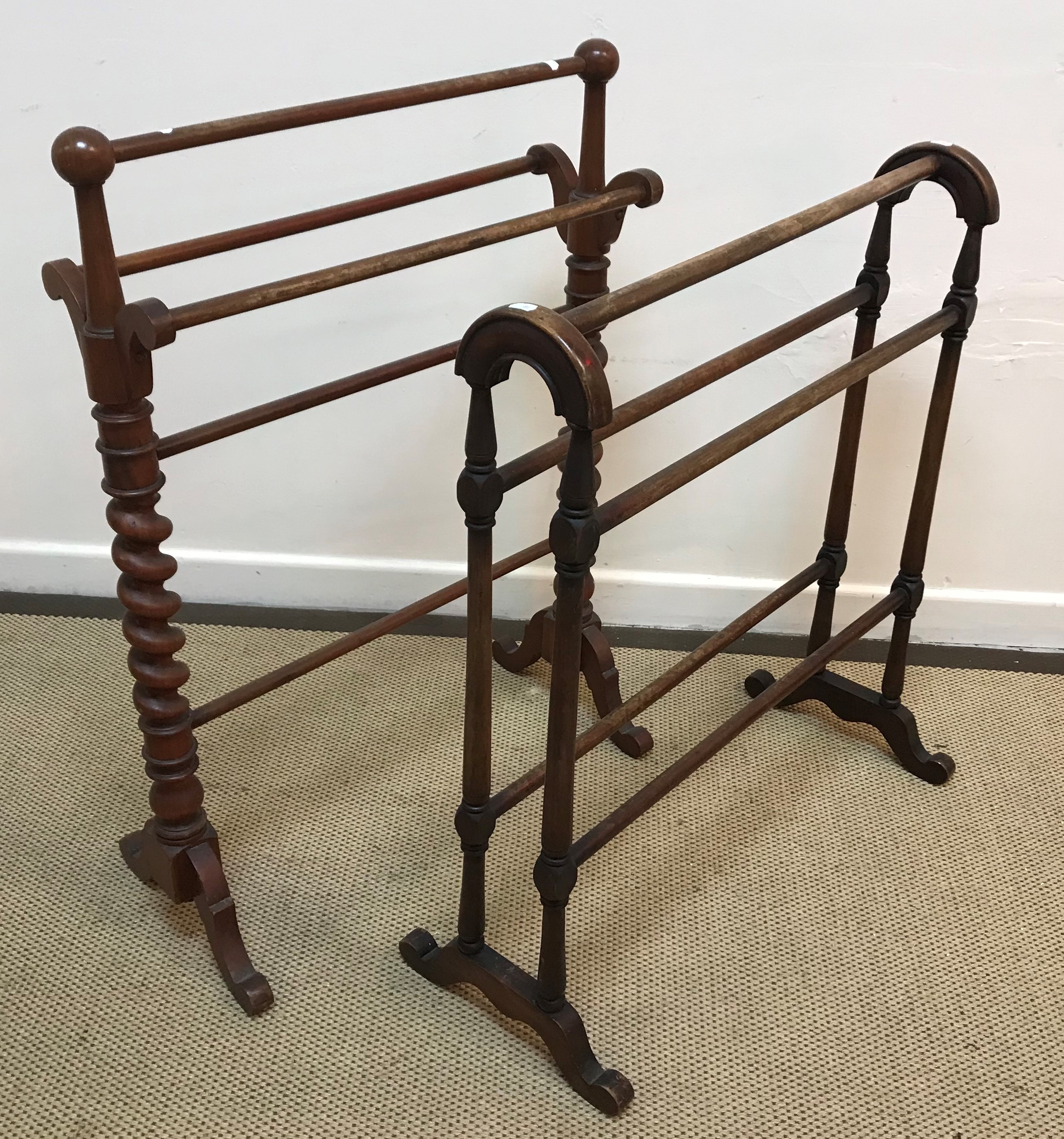 A Victorian towel rail on barley-twist supports and another similar towel rail