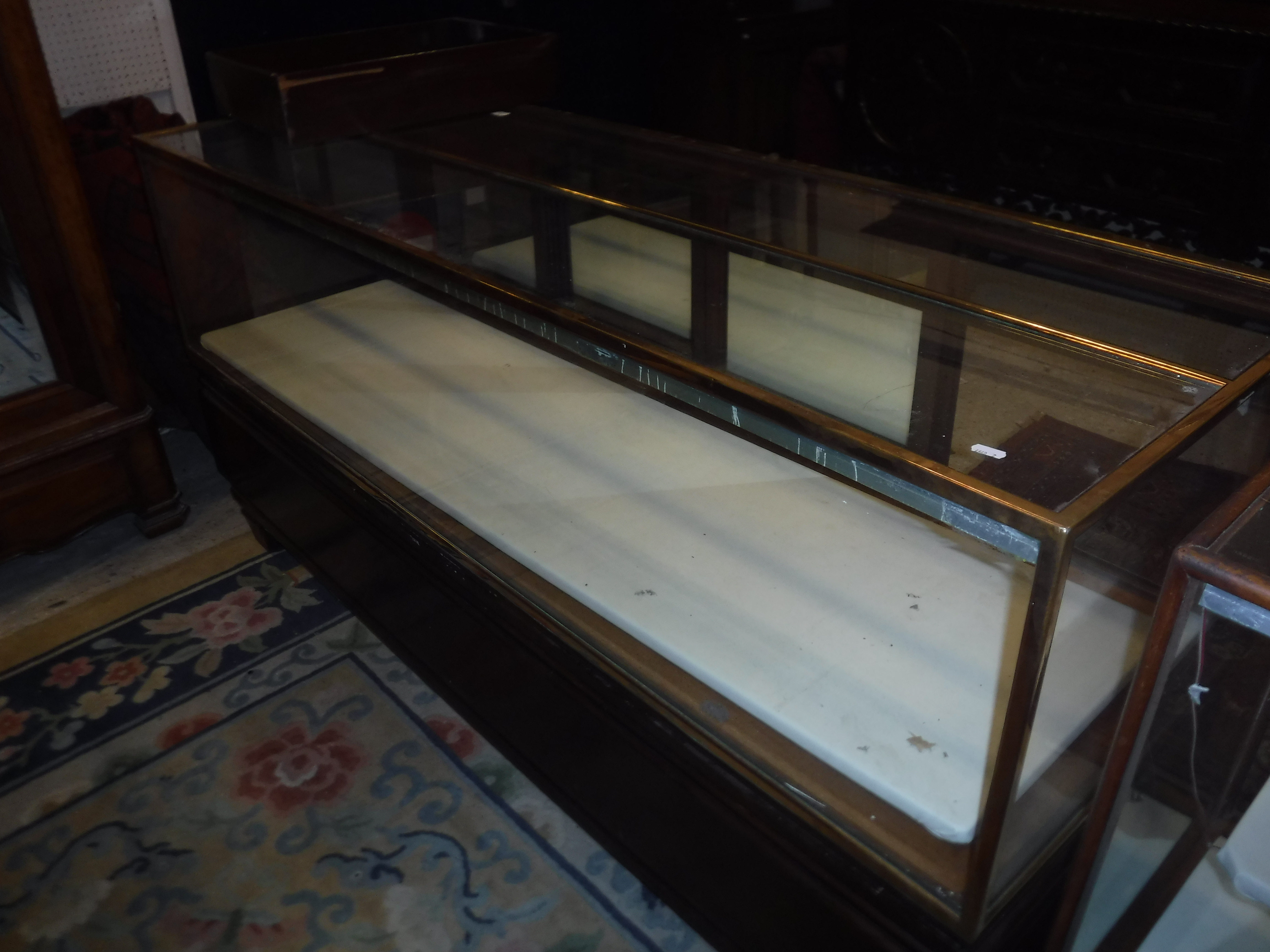 An early 20th Century brass framed and mahogany and glazed shop counter with four sliding doors - Image 2 of 11