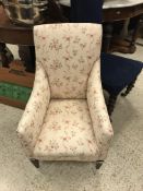 A Victorian upholstered prie a dieu chair on turned front legs to castors,