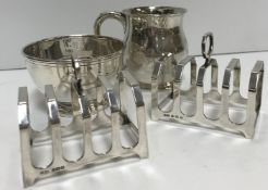 A collection of silver comprising a pair of four section toast racks (by I S Greenberg & Co.