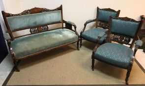 A late Victorian rosewood and marquetry inlaid salon suite of two seat sofa and pair of low open
