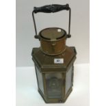 A circa 1900 brass hexagonal signalling lamp with swing handle to the top and signalling handle to