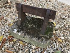 An iron boot scrape on concrete base,