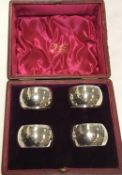 A set of four silver napkin rings (by Thomas Bradbury, Sheffield), No'd “1-4”, 1.
