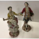 A pair of 19th Century Continental porcelain figures,
