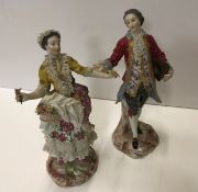 A pair of 19th Century Continental porcelain figures,