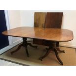 An early 19th Century mahogany dining table,