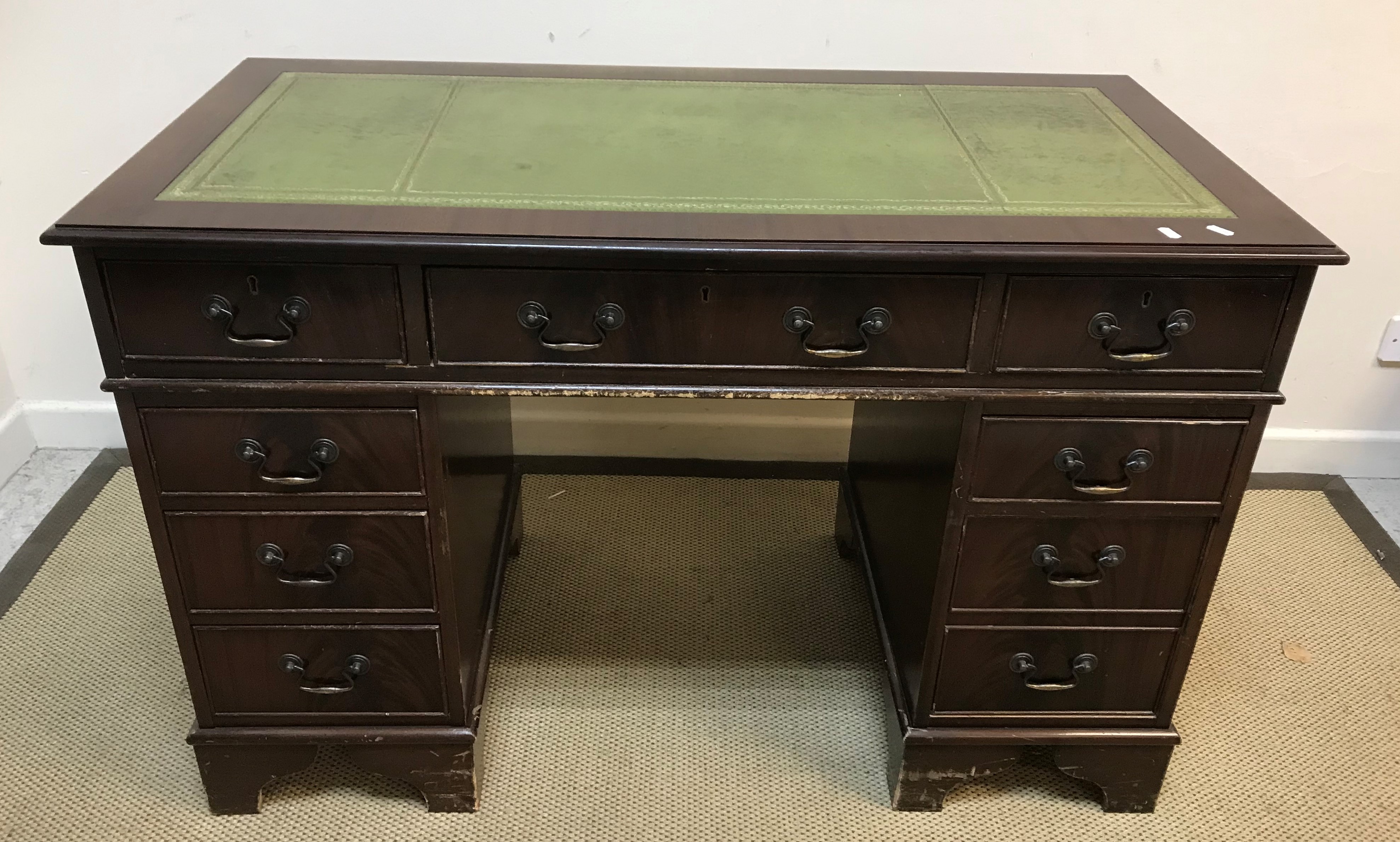 A modern mahogany kneehole desk in the Georgian style,