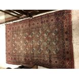 A Bokhara rug, the central panel set with a stepped black geometric pattern border,