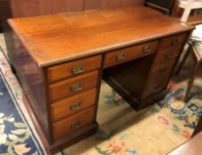 A late Victorian mahogany kneehole desk,