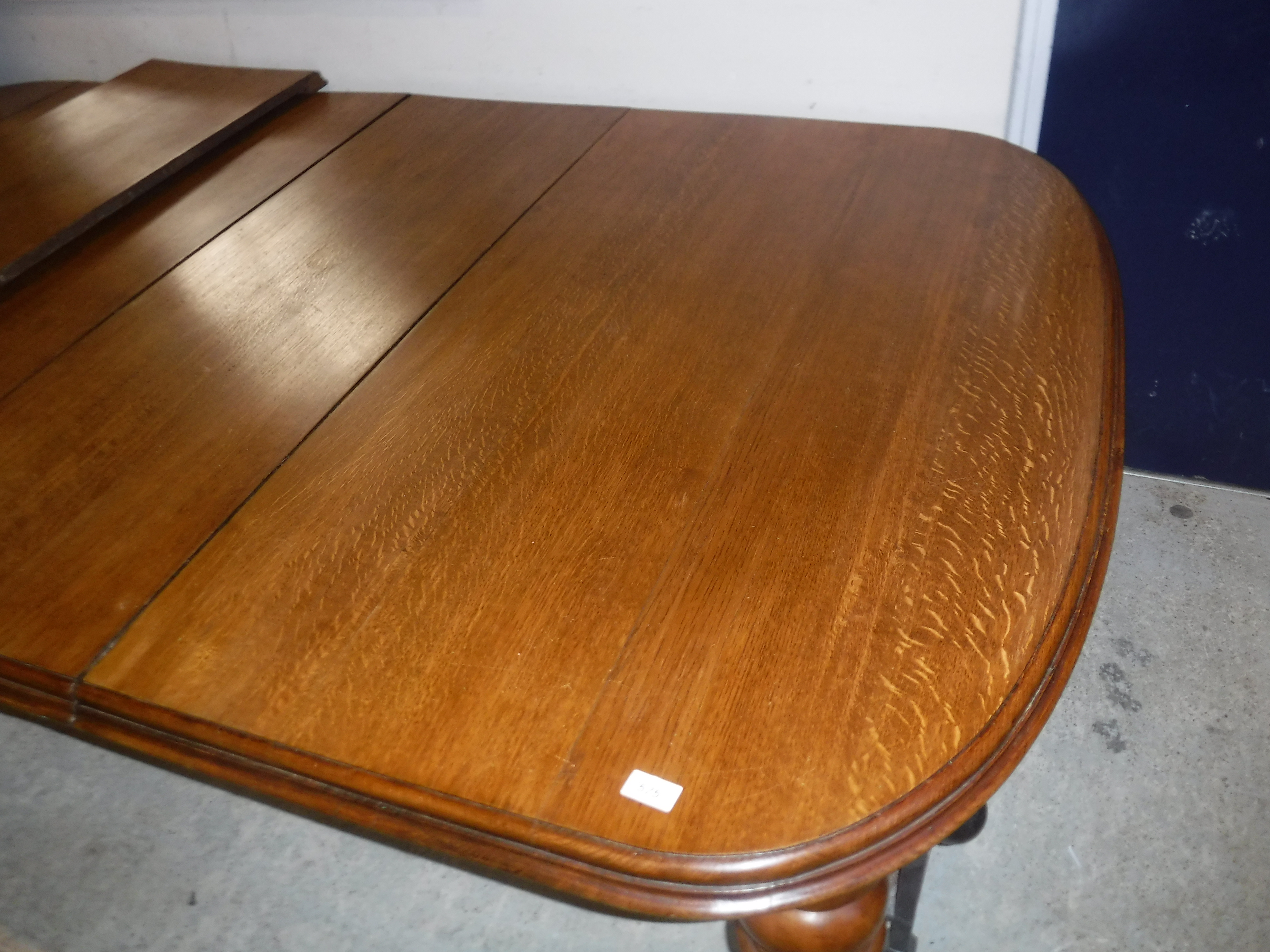A Victorian oak shallow D end extending dining table with three extra leaves and moulded edge, - Image 3 of 20