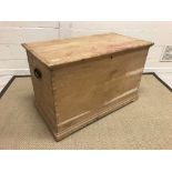 A pine tack box of plain form on a bracket foot base with wrought iron side carrying handles, 112.