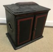 A Victorian black and red leather covered table top cabinet of sarcophagus form,