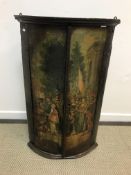 An 18th Century lacquered and painted bow fronted hanging corner cupboard,