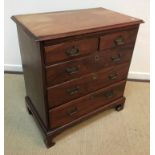 A George III mahogany bachelor's chest, the top with applied moulded edge over a brushing slide,