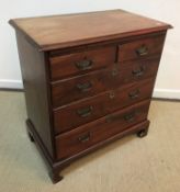 A George III mahogany bachelor's chest, the top with applied moulded edge over a brushing slide,