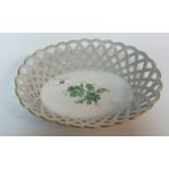 A 20th Century Berlin KPM porcelain chestnut basket with pierced oval main body the centrefield