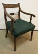 An 18th Century Provincial Chippendale oak carver chair with fretwork carved back splat and scroll