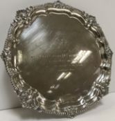 A mid 20th Century silver salver with shell and gadrooned edge,