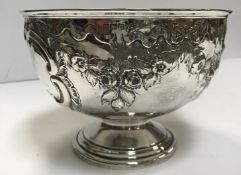 A Victorian silver rose bowl with embossed floral swag decoration,